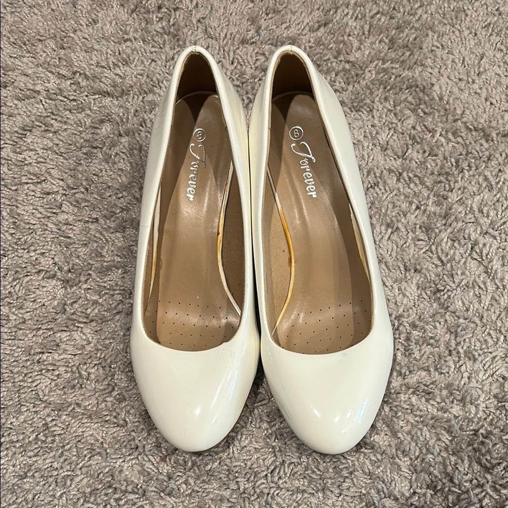 White paten leather wedges. Size 8. Worn a few times. Color on sole is from glue